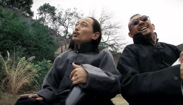 《让子弹飞》吃着火锅唱着歌那句完整台词是什么？